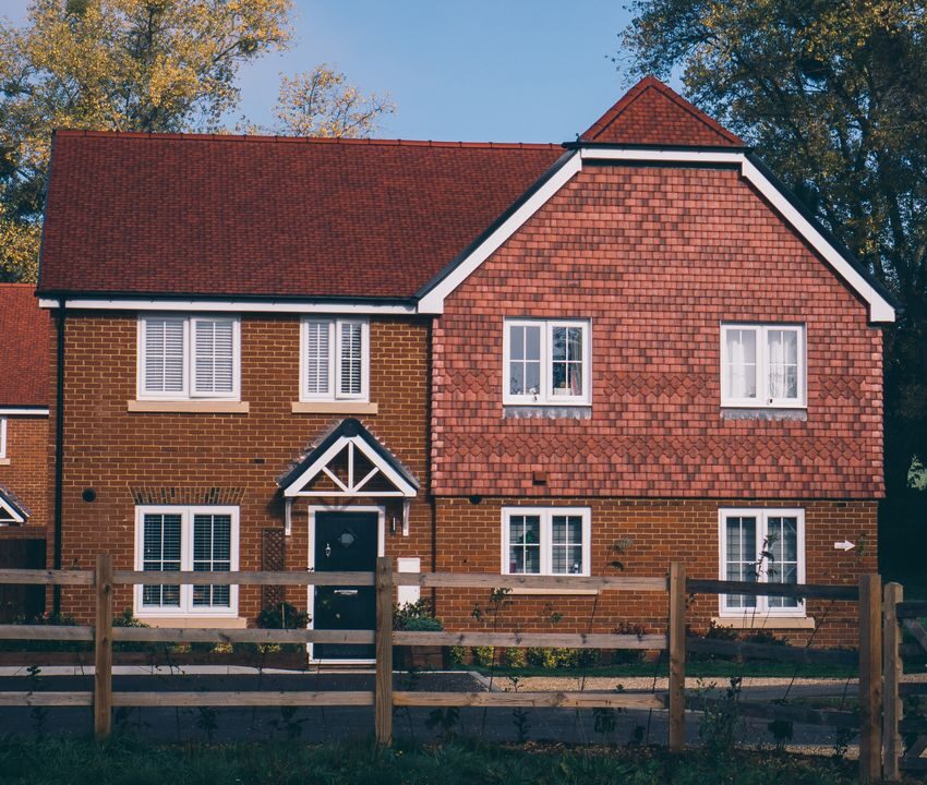 Beautiful detached house with wooden fence.